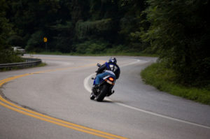 Motorcyclist on winding road